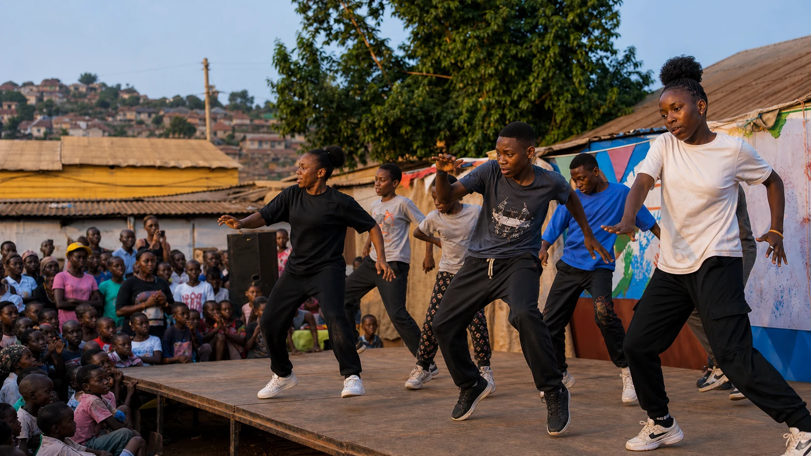 Young Ugandan dancers performing on a community stage in Kampala
