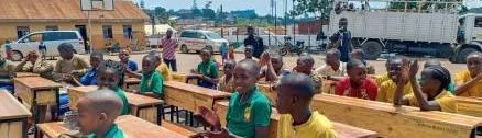 Children using desks supplied through the Africa Hope Campus Program