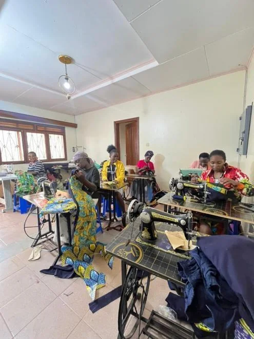 Women learning sewing skills in Kampala